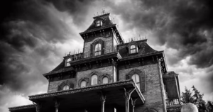 Halloween-themed image of a haunted house representing homeowners insurance coverage